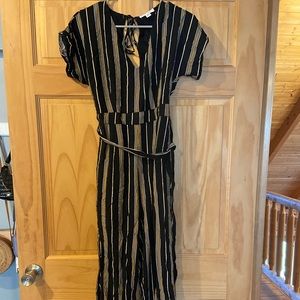 Francesca’s short sleeve jumpsuit, black with white & yellow stripes. Size M.
